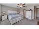 Comfortable bedroom with a queen-size bed and ample closet space at 288 Rain Berry Ave, Ruskin, FL 33570