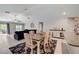 Dining area with a rustic wooden table and view into living room at 288 Rain Berry Ave, Ruskin, FL 33570