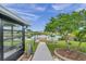 Walkway to private dock overlooks peaceful canal at 1707 Tahoe Dr, Sun City Center, FL 33573