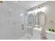 Modern bathroom with marble shower and gold accents at 1707 Tahoe Dr, Sun City Center, FL 33573