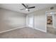 Bright bedroom with ceiling fan and ample closet space at 1707 Tahoe Dr, Sun City Center, FL 33573