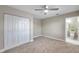 Spacious bedroom with ceiling fan and built-in closet at 1707 Tahoe Dr, Sun City Center, FL 33573