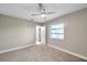 Well-lit bedroom, featuring a window and ceiling fan at 1707 Tahoe Dr, Sun City Center, FL 33573