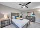 Cozy bedroom with gray wood furniture and a ceiling fan at 1707 Tahoe Dr, Sun City Center, FL 33573