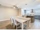 Dining room with white table and chairs, adjacent to updated kitchen at 1707 Tahoe Dr, Sun City Center, FL 33573