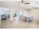 Open concept dining area with light wood floors and access to the living room and kitchen at 1707 Tahoe Dr, Sun City Center, FL 33573