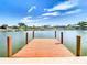 Private dock extending over calm water, offering waterfront access and scenic views at 1707 Tahoe Dr, Sun City Center, FL 33573