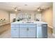 Kitchen island with white quartz countertop and stainless steel appliances at 1707 Tahoe Dr, Sun City Center, FL 33573