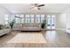 Spacious living room featuring hardwood floors and a view to the backyard at 1707 Tahoe Dr, Sun City Center, FL 33573