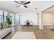 Open living space with hardwood floors, white accent wall and stylish furniture at 1707 Tahoe Dr, Sun City Center, FL 33573