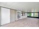 Large screened porch with tile floors and french doors at 1707 Tahoe Dr, Sun City Center, FL 33573