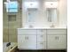 Elegant bathroom with double vanity and glass shower at 3708 Wiggins Leaf St, Tampa, FL 33619