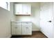 White cabinets and countertop with a window above at 3708 Wiggins Leaf St, Tampa, FL 33619
