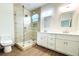 Spa-like bathroom with double vanity and large shower at 3708 Wiggins Leaf St, Tampa, FL 33619