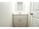 Modern bathroom with white cabinets, dual sinks, and a glass shower at 3708 Wiggins Leaf St, Tampa, FL 33619