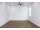 Simple bedroom with hardwood floors and neutral walls at 3708 Wiggins Leaf St, Tampa, FL 33619