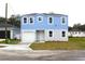 Two-story house with blue siding, white garage door, and landscaping at 3708 Wiggins Leaf St, Tampa, FL 33619
