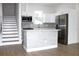 Modern kitchen with white cabinets, stainless steel appliances, and island at 3708 Wiggins Leaf St, Tampa, FL 33619