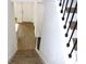 Modern staircase with dark wood railings and flooring at 3708 Wiggins Leaf St, Tampa, FL 33619