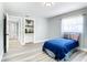 Charming bedroom featuring a twin bed and built-in shelving at 301 Casler Ave, Clearwater, FL 33755