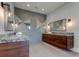 Modern bathroom with double vanity, granite countertop and large mirrors at 9586 Troutwater Ln, Tampa, FL 33618