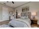 Bright bedroom with a cozy bed, hardwood floors, and ceiling fan at 9586 Troutwater Ln, Tampa, FL 33618