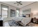 Spacious bedroom with large windows, comfortable bed, and stylish decor at 9586 Troutwater Ln, Tampa, FL 33618
