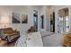 Bedroom with sitting area and access to a bathroom and hallway at 9586 Troutwater Ln, Tampa, FL 33618