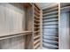 Spacious walk-in closet with ample shelving and hanging space at 9586 Troutwater Ln, Tampa, FL 33618