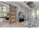 Entryway with sliding barn door and stone feature wall at 9586 Troutwater Ln, Tampa, FL 33618