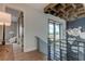 Light-filled hallway featuring a contemporary design and view to another room at 9586 Troutwater Ln, Tampa, FL 33618