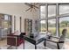 Bright home office with large windows and built-in shelving at 9586 Troutwater Ln, Tampa, FL 33618