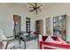 Bright home office with large windows and built-in shelving at 9586 Troutwater Ln, Tampa, FL 33618