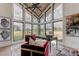 Bright home office with large windows, offering scenic views at 9586 Troutwater Ln, Tampa, FL 33618