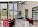 Bright home office with large windows, offering scenic views at 9586 Troutwater Ln, Tampa, FL 33618