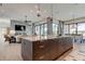 Open concept kitchen with island and breakfast bar, overlooking living area at 9586 Troutwater Ln, Tampa, FL 33618