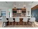 Modern kitchen with large island and stainless steel appliances at 9586 Troutwater Ln, Tampa, FL 33618