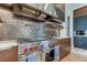 Modern kitchen with stainless steel appliances and wood cabinetry at 9586 Troutwater Ln, Tampa, FL 33618