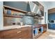 Modern kitchen with stainless steel range and wood cabinetry at 9586 Troutwater Ln, Tampa, FL 33618