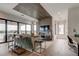 Spacious living room with water view, modern decor, and wood accents at 9586 Troutwater Ln, Tampa, FL 33618