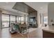 Spacious living room with water view, modern decor, and wood accents at 9586 Troutwater Ln, Tampa, FL 33618