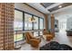 Relaxing sitting area with two armchairs and a view at 9586 Troutwater Ln, Tampa, FL 33618