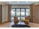Relaxing sitting area with two armchairs and a view at 9586 Troutwater Ln, Tampa, FL 33618