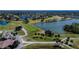 Aerial view of golf course community with lake and houses at 1032 Radison Ave # 2, Sun City Center, FL 33573