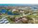 Aerial view of community tennis courts and lake at 1032 Radison Ave # 2, Sun City Center, FL 33573