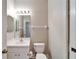 Simple bathroom with white toilet and sink at 1032 Radison Ave # 2, Sun City Center, FL 33573