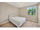 Bright bedroom with a queen bed and large window at 1032 Radison Ave # 2, Sun City Center, FL 33573