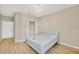 Bright bedroom with a queen-size bed and light wood floors at 1032 Radison Ave # 2, Sun City Center, FL 33573