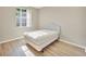 Simple bedroom with a queen bed and window at 1032 Radison Ave # 2, Sun City Center, FL 33573