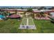 Aerial view of two bocce ball courts, surrounded by lush landscaping and a community building at 1032 Radison Ave # 2, Sun City Center, FL 33573